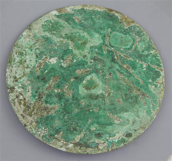 A Chinese bronze circular mirror, Western Han dynasty, 2nd century B.C. 14cm diameter, repair to edge